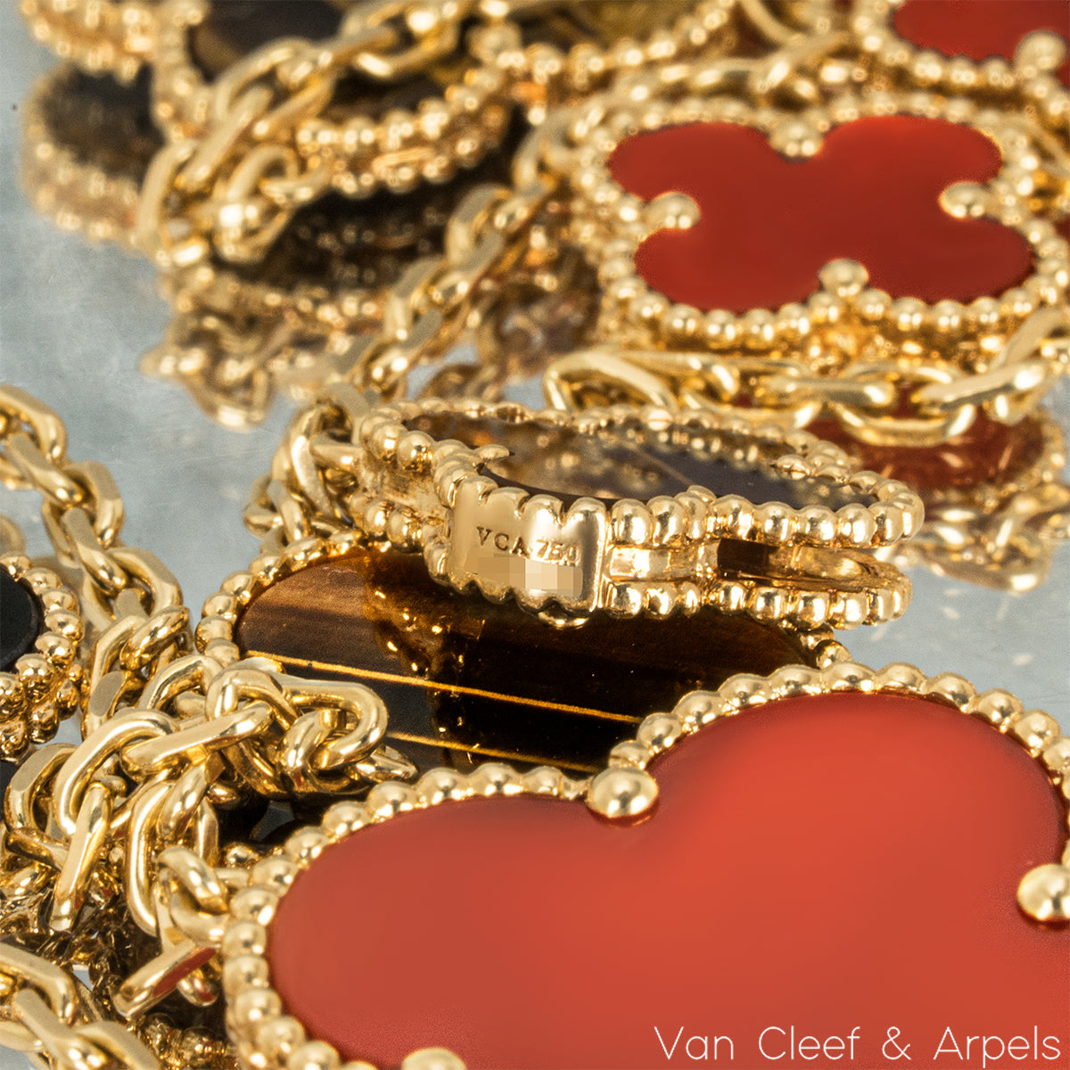 Van Cleef & Arpels Yellow Gold Carnelian & Tiger Eye Magic Alhambra 16 Motif Necklace VCARN5JO00